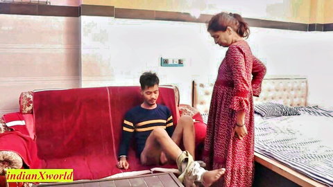 Desi woman in red dress stands over injured man, teasing amateur couple scene