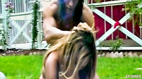 Blonde big-titty MILF rammed doggy style by muscular man in garden