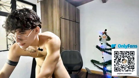 Friendly naked Latino guy with curly hair and glasses posing nude solo
