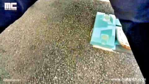 Outdoor gravel ground with turquoise geometric mat and orange object in Japanese gay porn preview