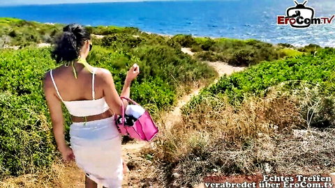 Brunette German tgirl in white skirt and crop top on Mallorca coastal path
