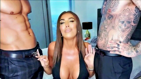 Brunette babe with huge cleavage teases playfully between two muscular tattooed hunks