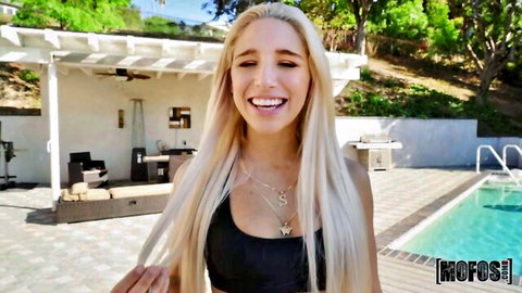 Abella Danger blonde smiling in black tank top by pool, POV interracial tease