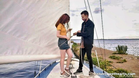 Hot Pearl in short skirt on yacht with man, outdoor tease
