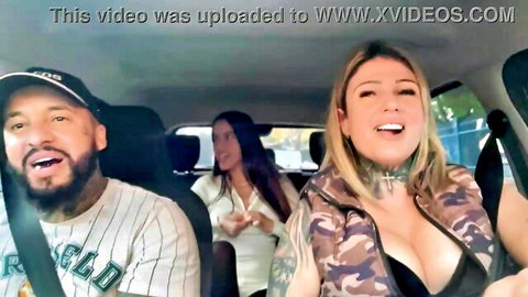 Blonde tattooed beauty in camo jacket flashes cleavage in Uber car with driver and friend in Sao Paulo