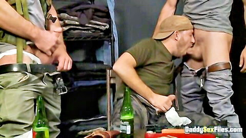 Military hunk giving blowjob in uniform pants-down party scene