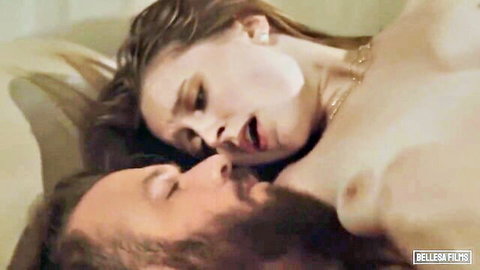 Blonde with huge tits passionately kisses bearded man while nude in bed