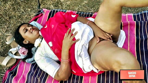 Hot Indian babe lies on outdoor picnic blanket spreading legs exposing shaved pussy