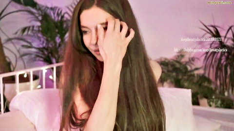 Brunette webcam solo babe covering her tits with hand teasing nude on bed