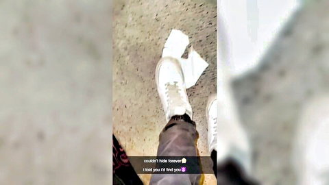 Blurry closeup of feet in white sneakers, possible foot fetish tease