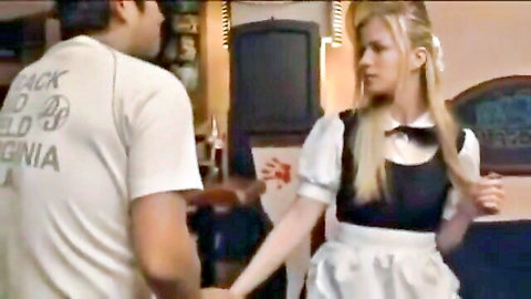 Blonde maid in sexy outfit flirting with man in casual t-shirt