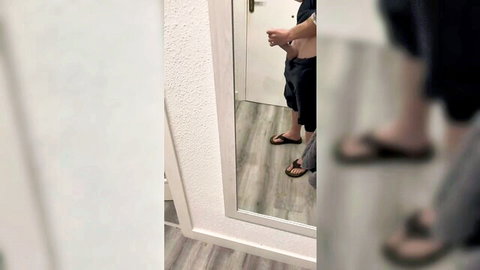 Man in mirror selfie applying almond oil care routine HD video