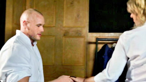 Bald man in white shirt intimately touches blonde woman in blouse from Tats And Sluts