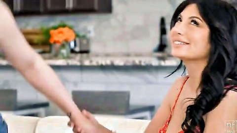 Busty brunette smiling seductively with cleavage in roommate tease scene