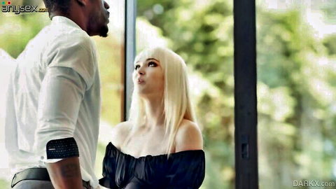 Lilly Bell gazes at her black boyfriend in black off-shoulder dress