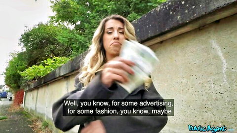 Blonde woman pouting while holding cash outdoors in Public Agent style