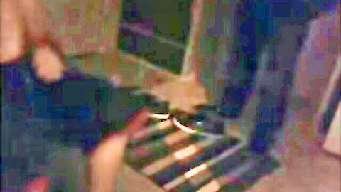 Blurry amateur blowjob scene: woman kneels to suck stoner man's cock