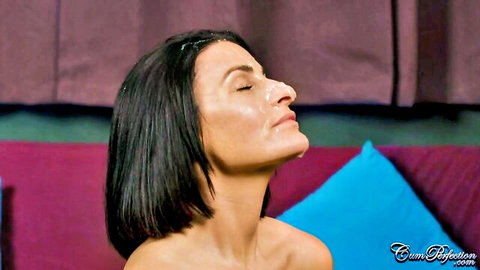 Sarah Wild with fresh facial cumshot, eyes closed in bliss