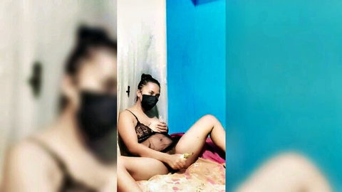 Mixed-race woman in black lingerie teasing and masturbating solo