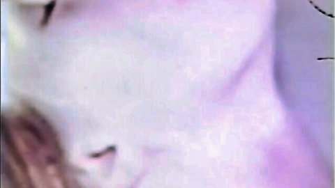 Close-up of woman's pursed lips and neck during vintage blowjob.