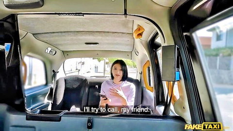 Asian woman in pink top calls friend in taxi cab, Fake Taxi tension builds