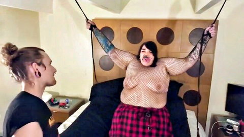 Plus-size goth woman in fishnets bound and topless, daddy disciplines her