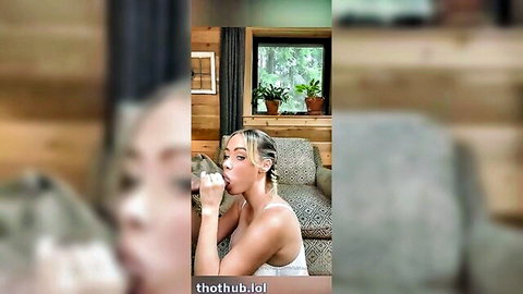 Skinny blonde with pigtails deepthroats fingers seductively on cabin couch