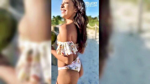 Malina Melendez in floral bikini on beach, smiling Latina with curvy ass