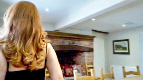 Scarlett redhead in black dress, first BDSM session back view