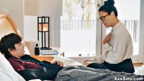 Dana in glasses and blouse seduces injured man in bed for wild sex