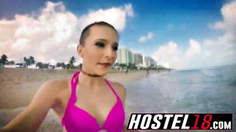 Buzzcut babe in skimpy pink bikini top flaunts huge tits on sunny beach