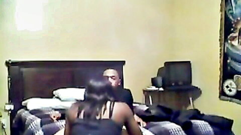 Ebony couple fucking doggy style on bed, black babe's ass out as stud thrusts hard