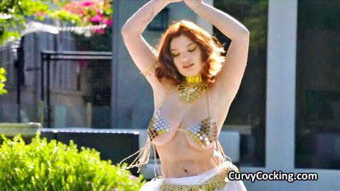 Curvy ginger in skimpy gold belly dance top dances outdoors