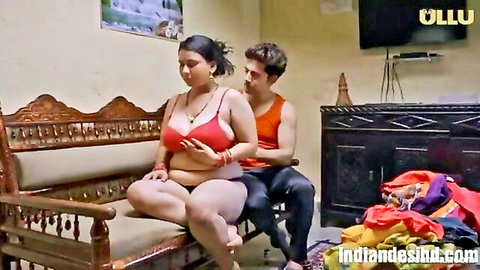 Busty Indian woman in red bra embraced by painter in Ullu Hindi series