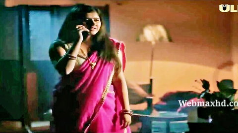 Indian woman in pink saree on emotional phone call, Ullu web series