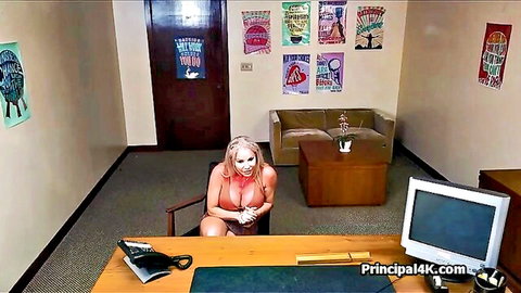 Busty mature blonde slut in revealing pink lingerie at office desk