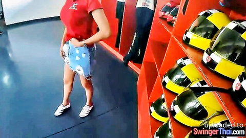 Amateur Asian teen with big tits in red top and shorts at go-kart track