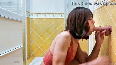 TS Irene Queen in red lingerie sucking giant dildo in bathroom