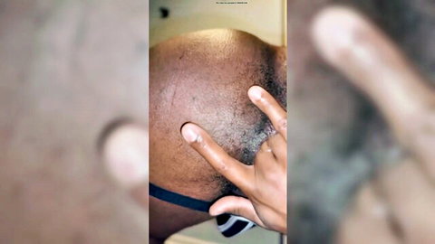Bald ebony man spreads tight black asshole with peace sign fingers in solo anal tease