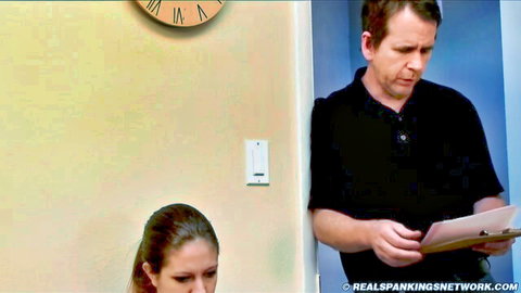 Strict principal disciplines Harlan with paddling in office scene