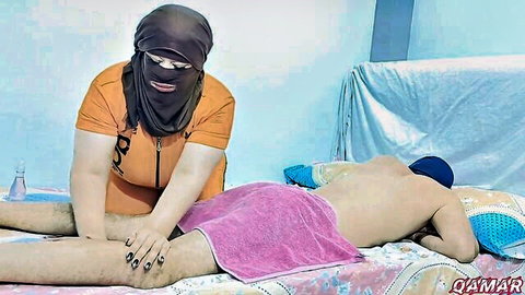 Arab woman in niqab massages client's thigh in amateur Egyptian scene