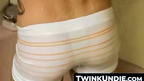 Wet gay twink's tight white striped undies cling to juicy bubble butt from behind
