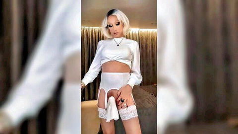 Blonde trans sissy in white crotchless lingerie exposes her hard cock and balls