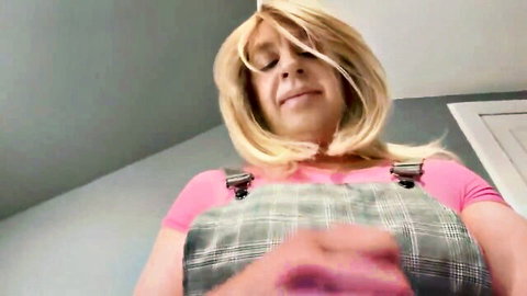 Alikat2 in pink top and plaid overalls, smiling seductively