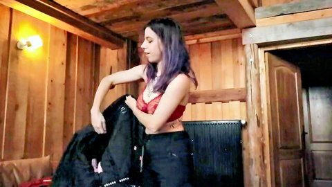Norage Vlog in red lace bralette and black pants, purple-haired slim beauty posing with jacket
