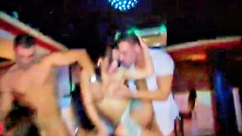 Intense anal group sex in a neon-lit disco club with muscular men and a brunette