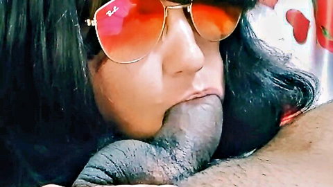 Woman with orange Ray-Ban sunglasses sucking thick black cock in close-up blowjob