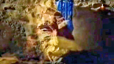 Vampire-themed adult scene from Dracula by Mario Salieri, woman in blue in cave