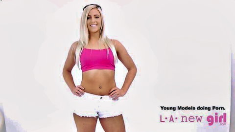 Blonde teen model in pink sports bra and white shorts at casting audition