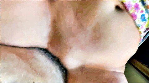Close-up peek at young woman's exposed pussy in floral panties